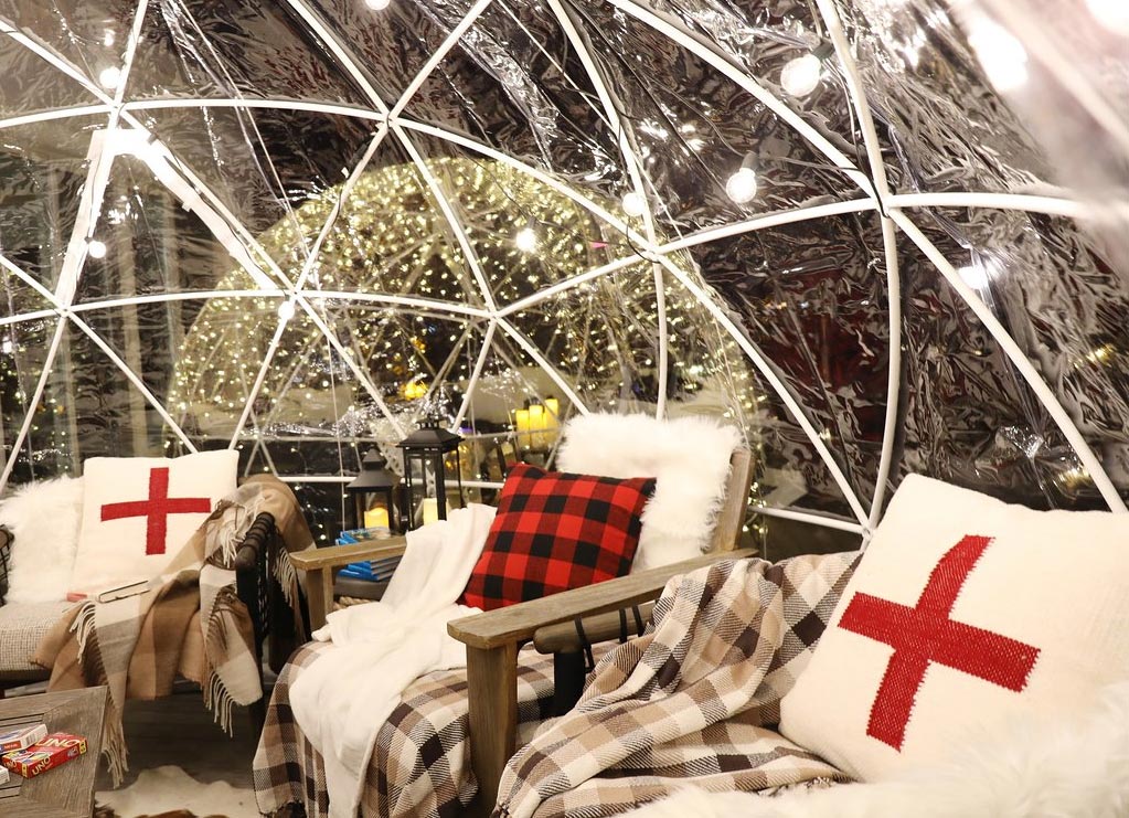 enjoy a cozy dinner outside in one of Newport's many heated igloos